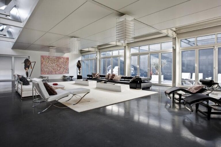 Large office space with dark grey Microcement floor sealed with Bi Sol