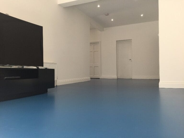 Domestic interior featuring Azure-Blue cushioned flooring system