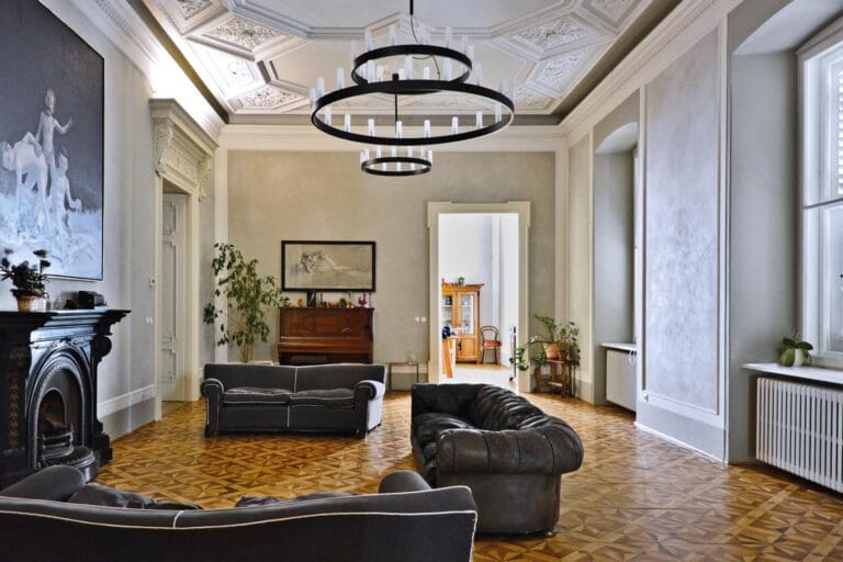 Formal sitting room with Rialto Sinopia lime plaster walls in soft taupe, paired with white ceiling