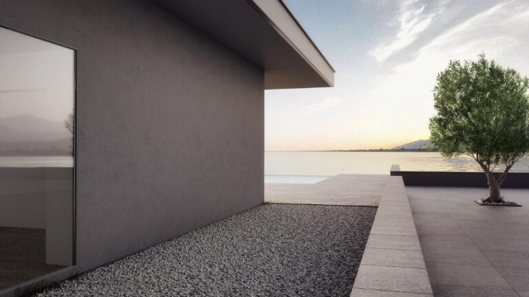 Contemporary building with grey Rialto Antiqua finish near water