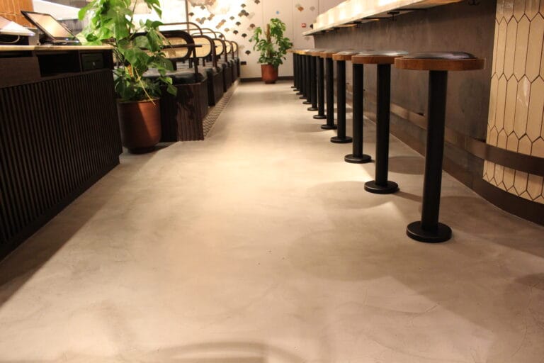 Kricket Restaurant interior with polished Politura Microcement flooring throughout