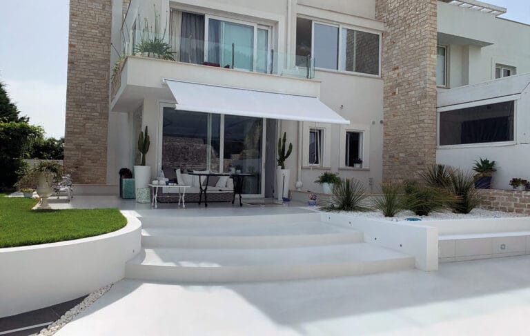 ErreLAB Pietra Continua Outdoor Basalto residential terrace with contemporary architecture