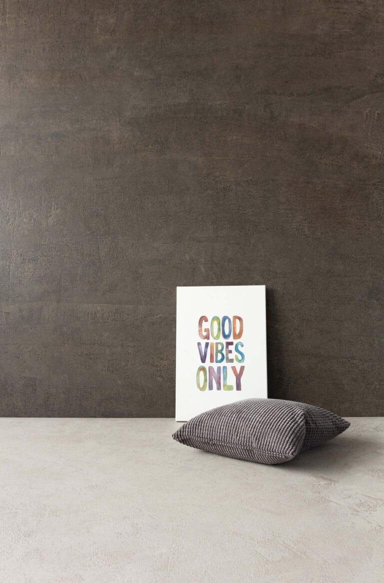 ErreLAB Pietra Continua Porfido two-tone wall finish with brown upper, cream lower and styled accents