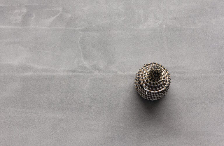 ErreLAB Pietra Continua Quarzite textured finish with decorative white sphere