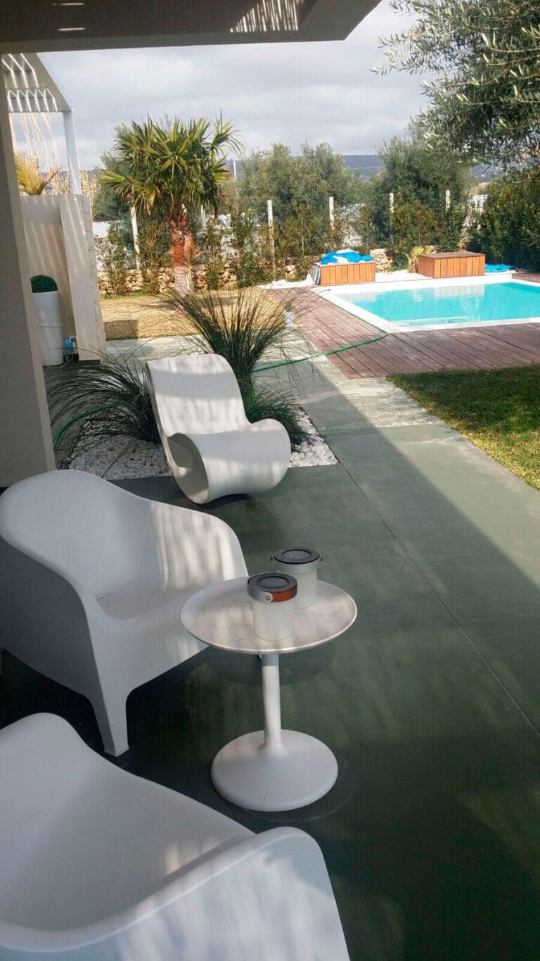 ErreLAB Spatolato Outdoor finish on resort pool deck with lounge seating