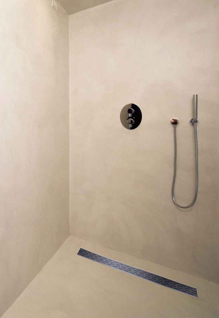 ErreLAB Velato cream resin in shower enclosure with floor and wall detail