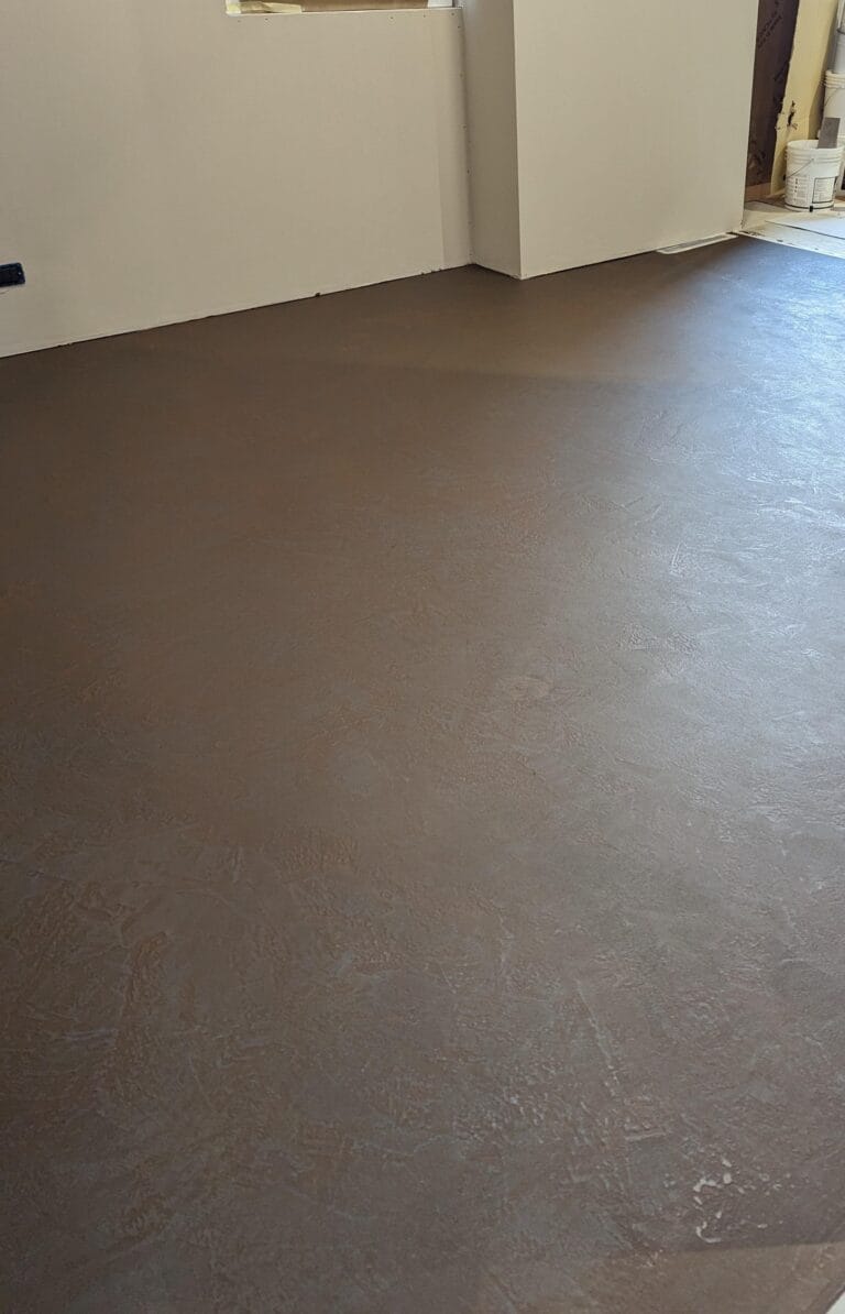 Metallo Trail dark metallic floor finish in a furniture showroom space