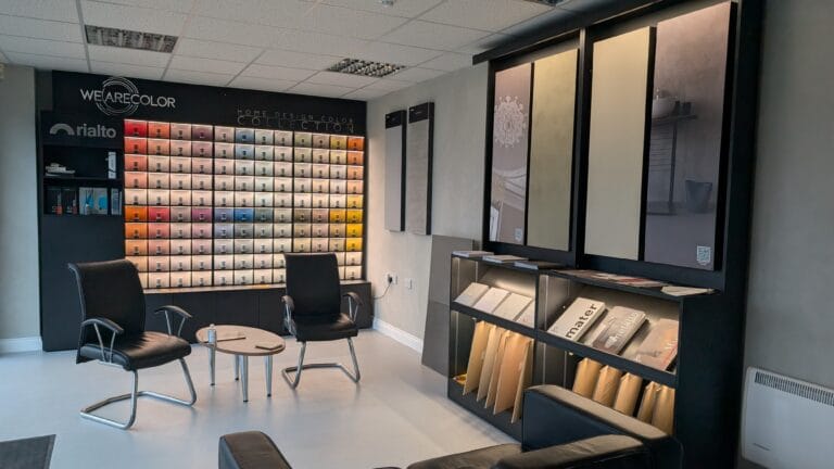 Contemporary showroom with pixelated colour-grid wall art and minimalist shelving displaying products